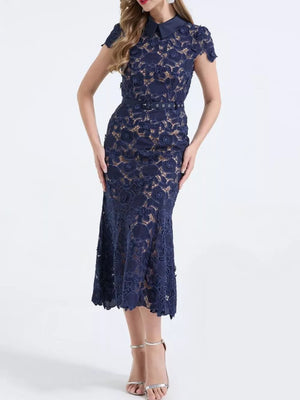 Dark blue lace midi dress with floral pattern, short sleeves, collar, and belt.