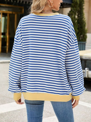 Striped crew neck sweatshirt in royal blue and white with a yellow hem and cuffs.