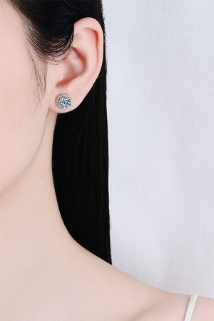 Silver rope-framed moissanite stud earrings with brilliant cut center stone.