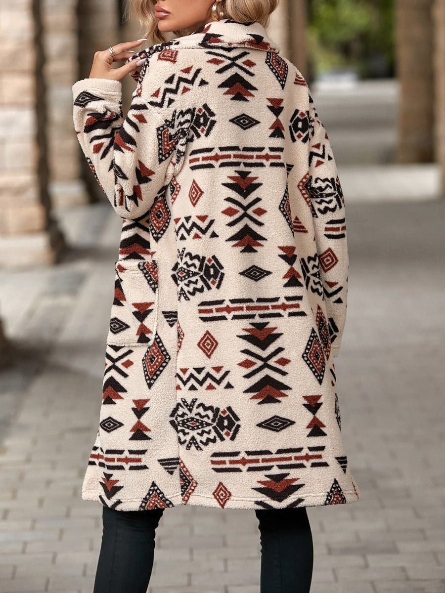 Longline teddy coat with Aztec print in cream, black, and rust, featuring pockets.