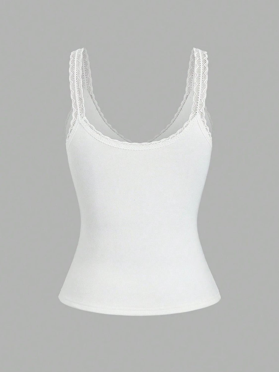 White ribbed cami with lace trim straps and neckline.