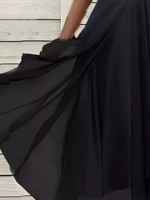 black midi dress featuring tiered and floral