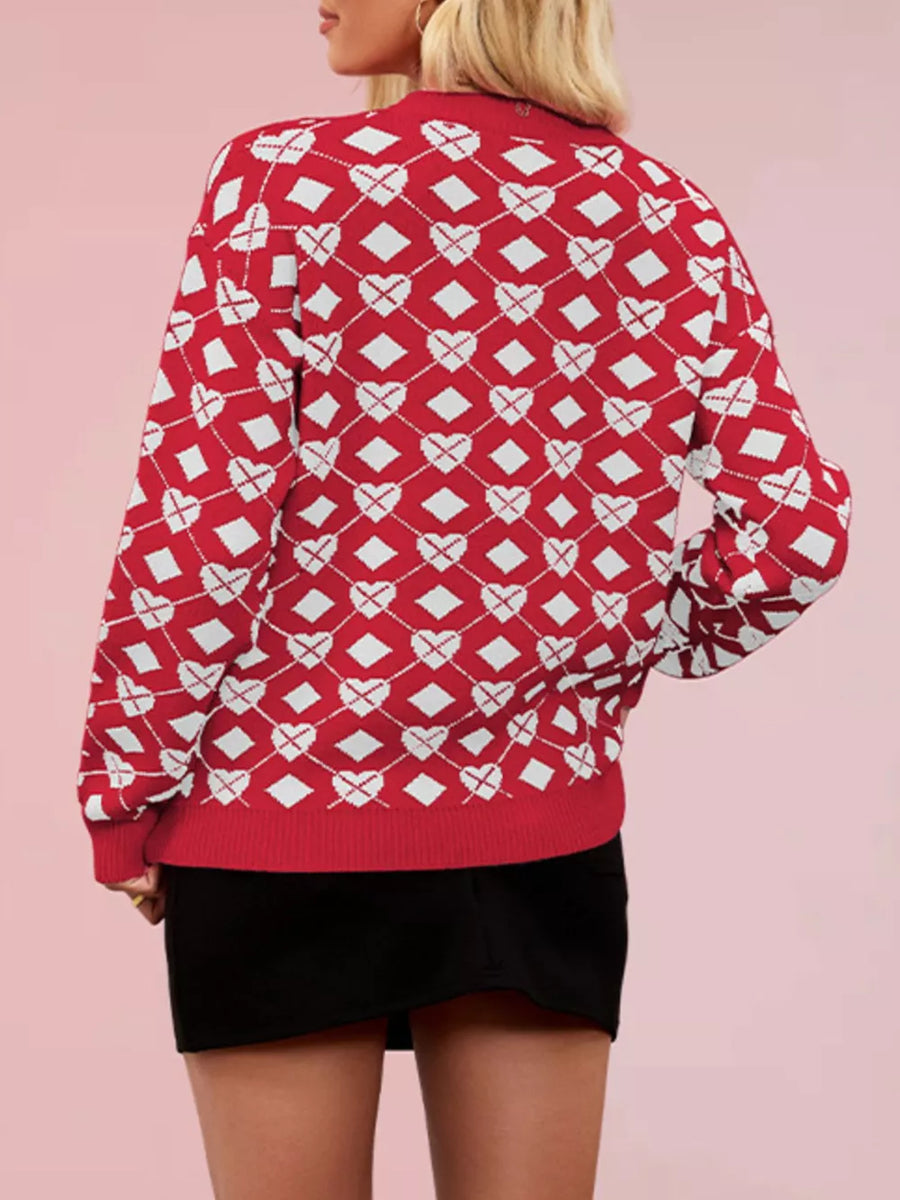 white pullover sweater featuring ribbed cuffs and argyle