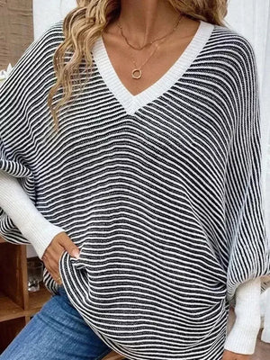 100% polyester Care instructions: Machine wash cold v-neck sweater in Black with loose silhouette