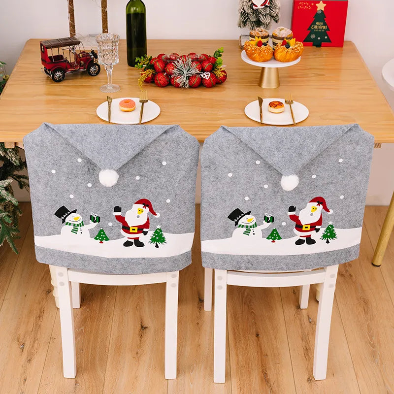 Gray chair covers with Santa and snowman Christmas applique and white pom-pom detail