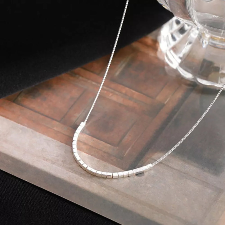necklace in silver with geometric and cube beads