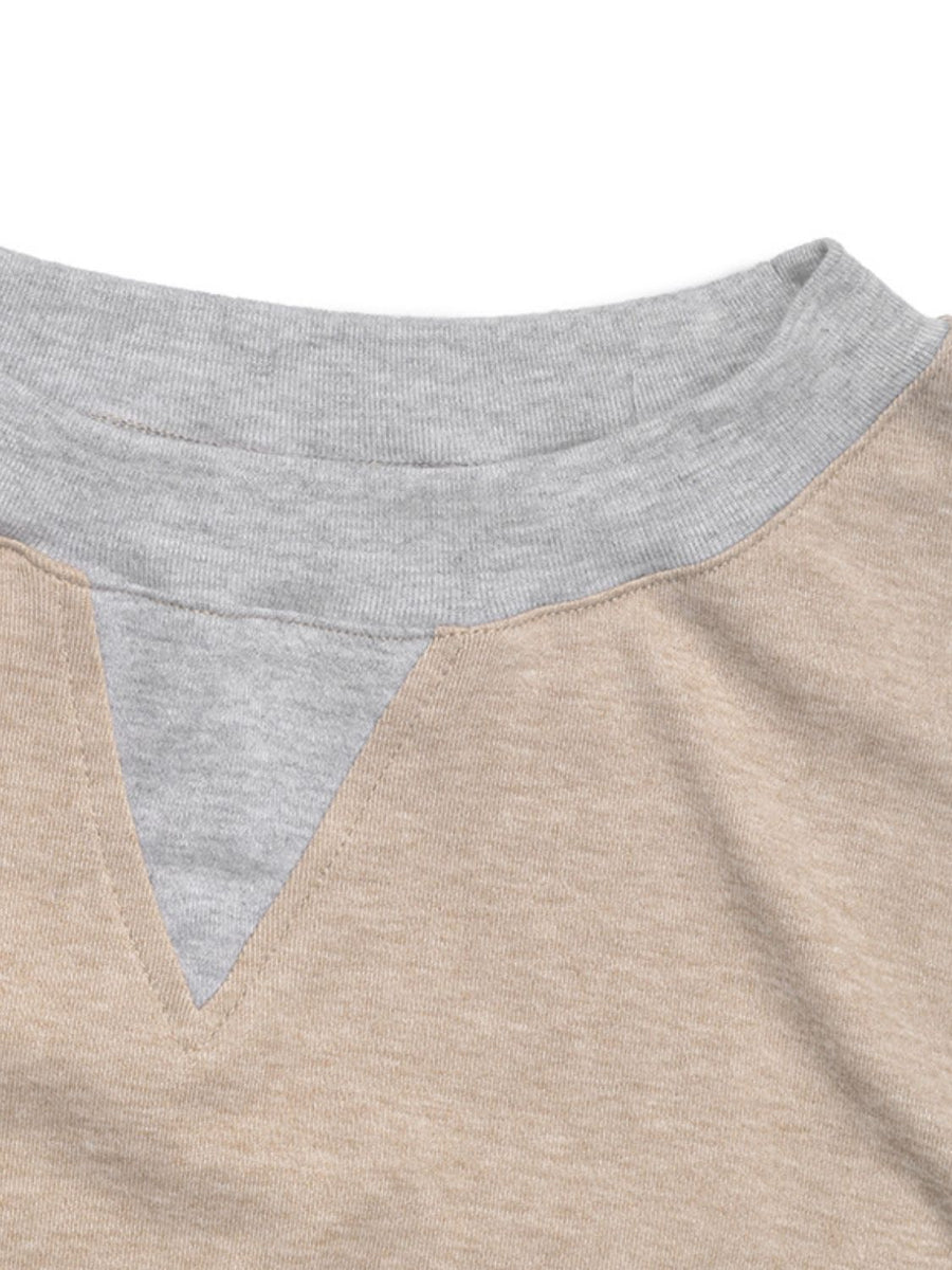 Tan and grey colorblock sweatshirt with V-neck detail and crew neck trim.