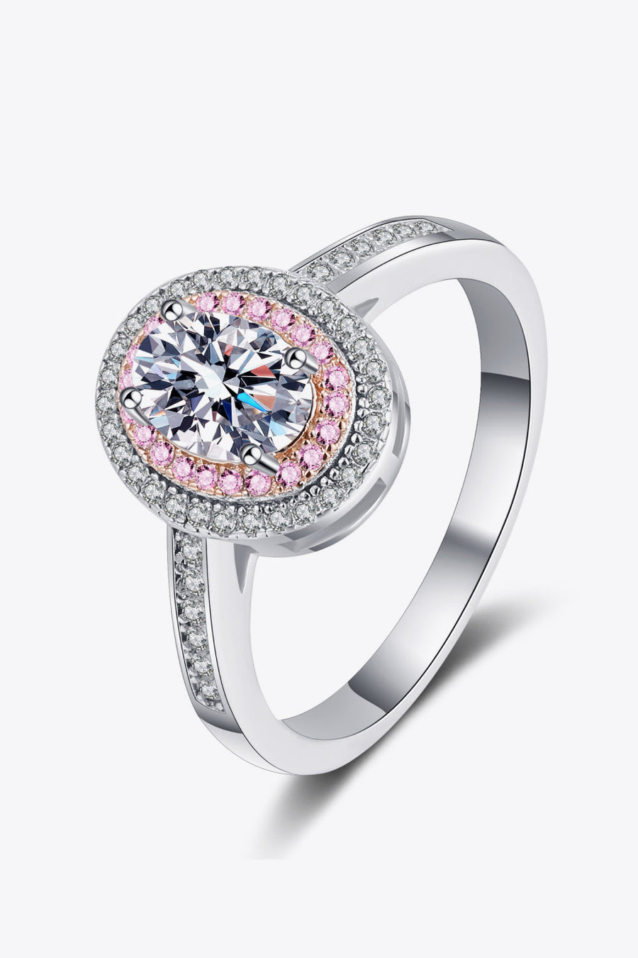 Silver ring with oval center stone and pink stone accents