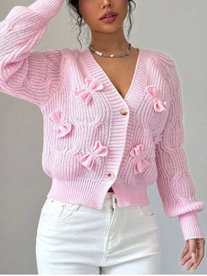 Pink cardigan featuring cable knit and cable knit