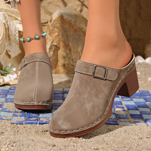 Chic round toe platform slip-ons in beige with buckle detail and contrast stitching.