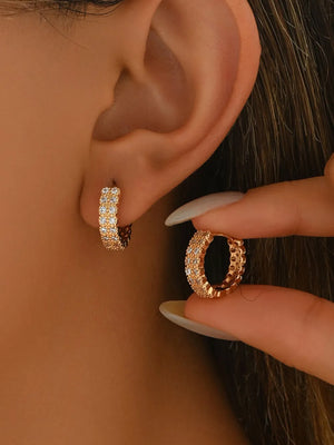 earrings in gold featuring zircon embellishment and hoop fit