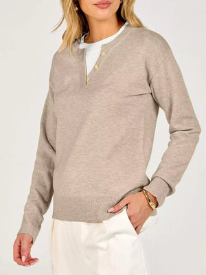 Navy pullover sweater with hip-length and half-button