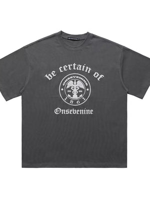 Grey oversized graphic t-shirt with vintage-inspired print and short sleeves.