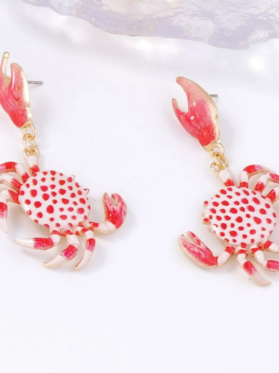 red earrings featuring crab shape and polka dot
