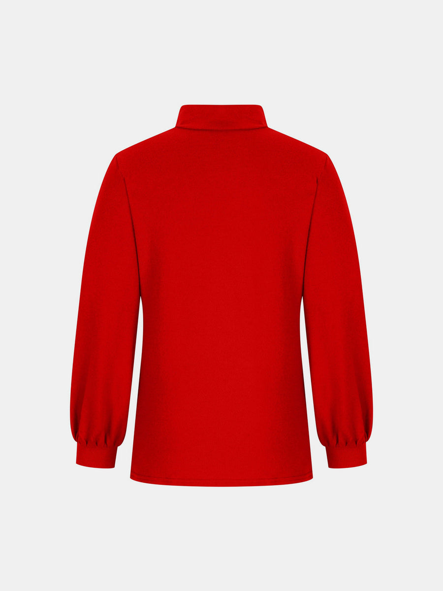 Button-back puff sleeve mock neck top in red with long sleeves and gathered cuffs.