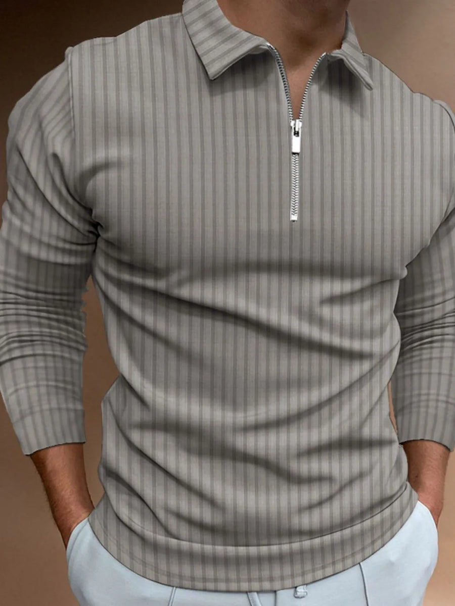 Gray textured zip-neck polo shirt with vertical stripes and long sleeves.