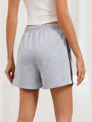 Heathered gray jogger shorts with sporty side trim and drawstring waist.