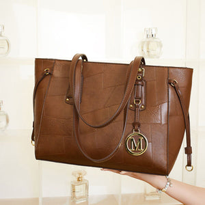 tote featuring patchwork in Brown with PU Leather Imported Size & texture