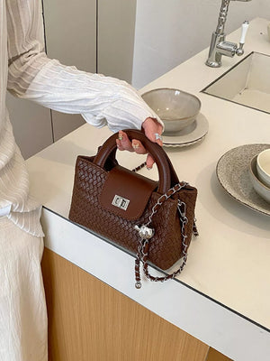 crossbody bag in chocolate brown featuring woven texture and boxy fit