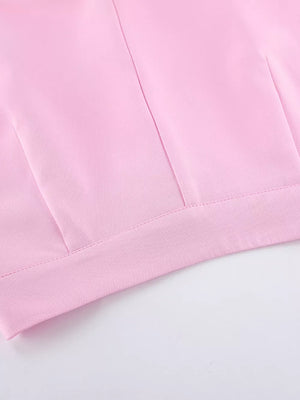 light pink two-piece set with hip-length top, full-length bottom and button, zipper