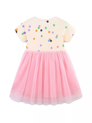 Toddler polka dot dress with pink tulle skirt and short sleeves.