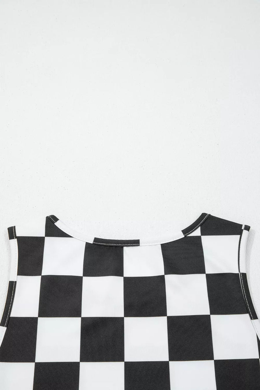 Graphic checkerboard seamless tank top with crew neck and white stitching.