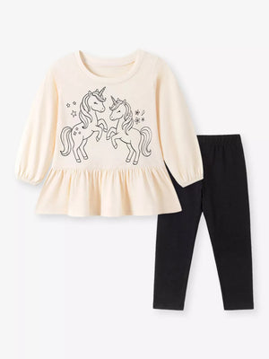 black peplum top featuring tiered and graphic print