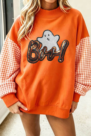 orange sweatshirt with gingham, sequin and mock neck