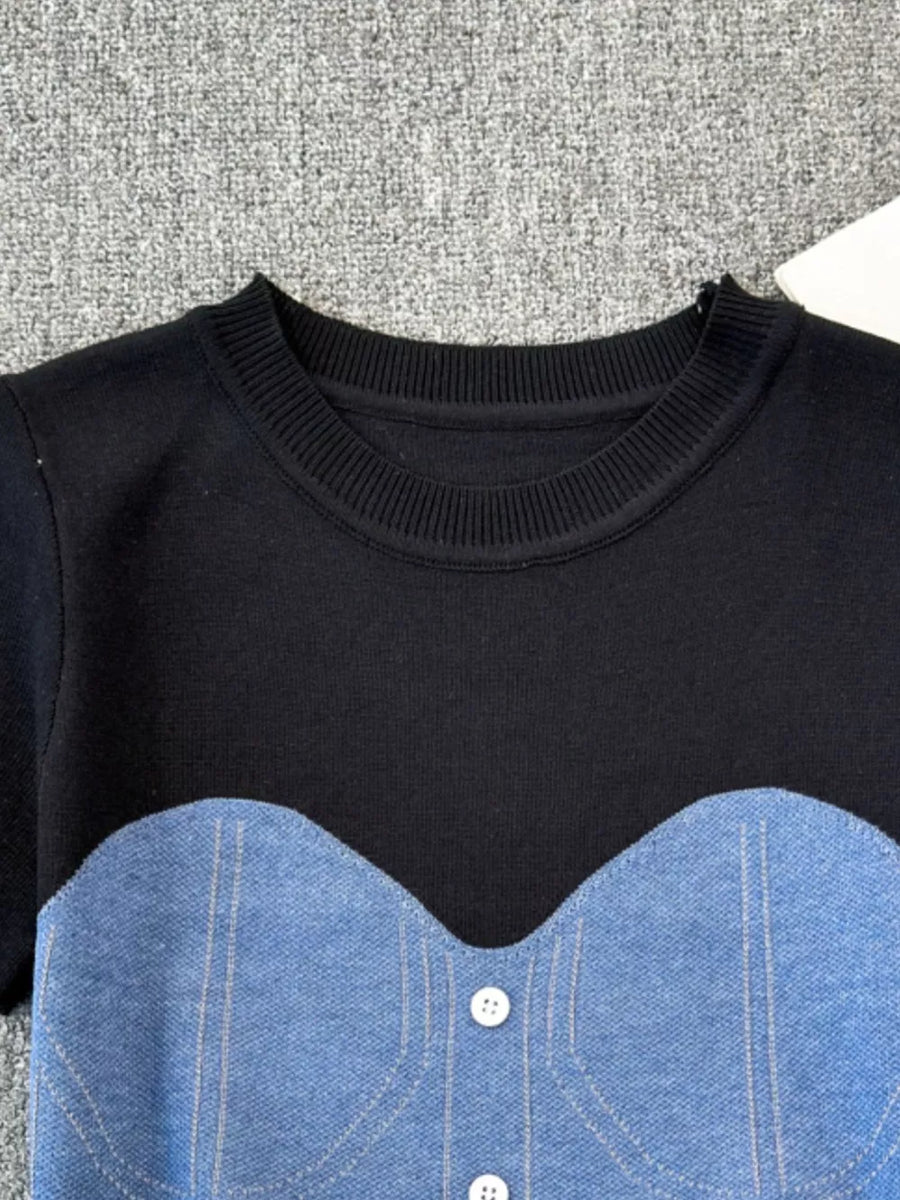 Color block knit t-shirt with ribbed neckline and denim bustier detail in black with blue.
