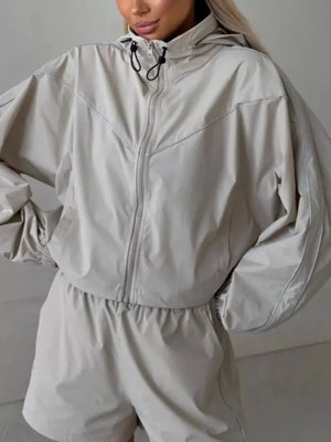 Dark Blue track jacket with drawstring waist and long sleeve