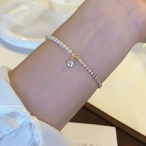 bracelet in gold featuring pearl accents and fitted fit