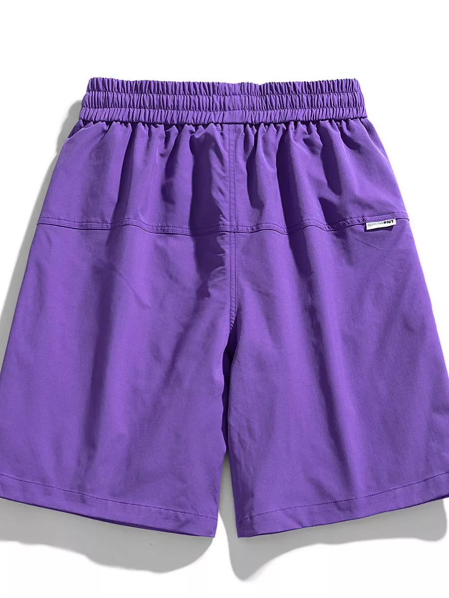 Purple relaxed fit cargo shorts with elastic waistband and back pocket detail.