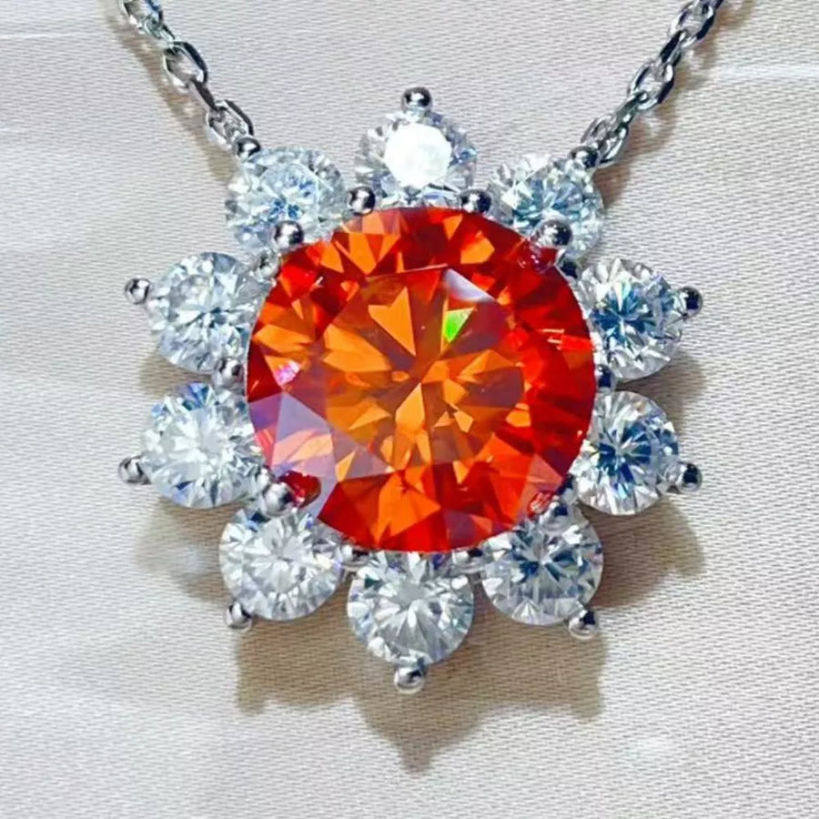 silver necklace featuring pendant and floral