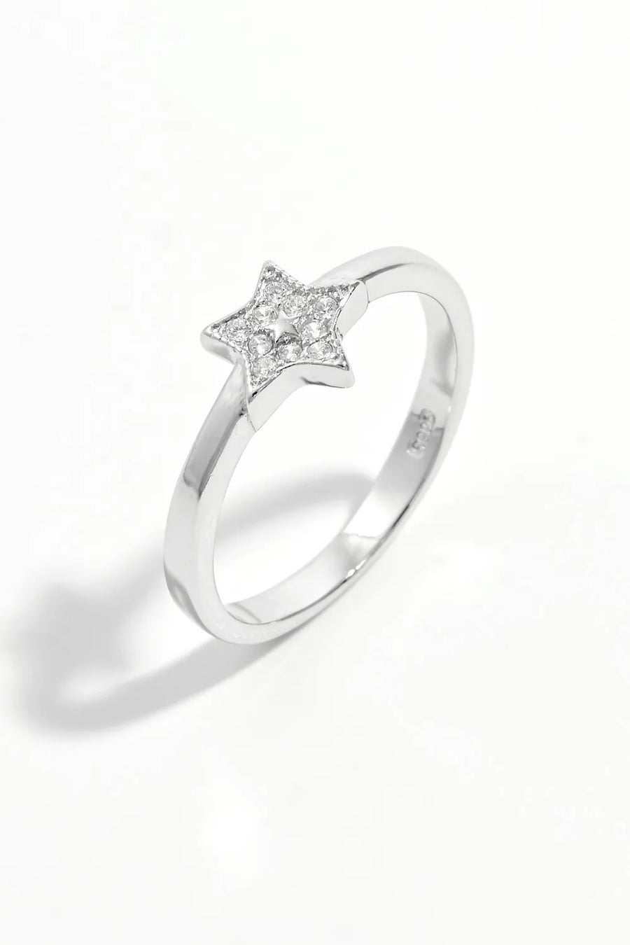 Silver ring with a diamond-encrusted star design