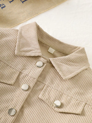 Casual tan corduroy button-up jacket with silver buttons and chest pockets.