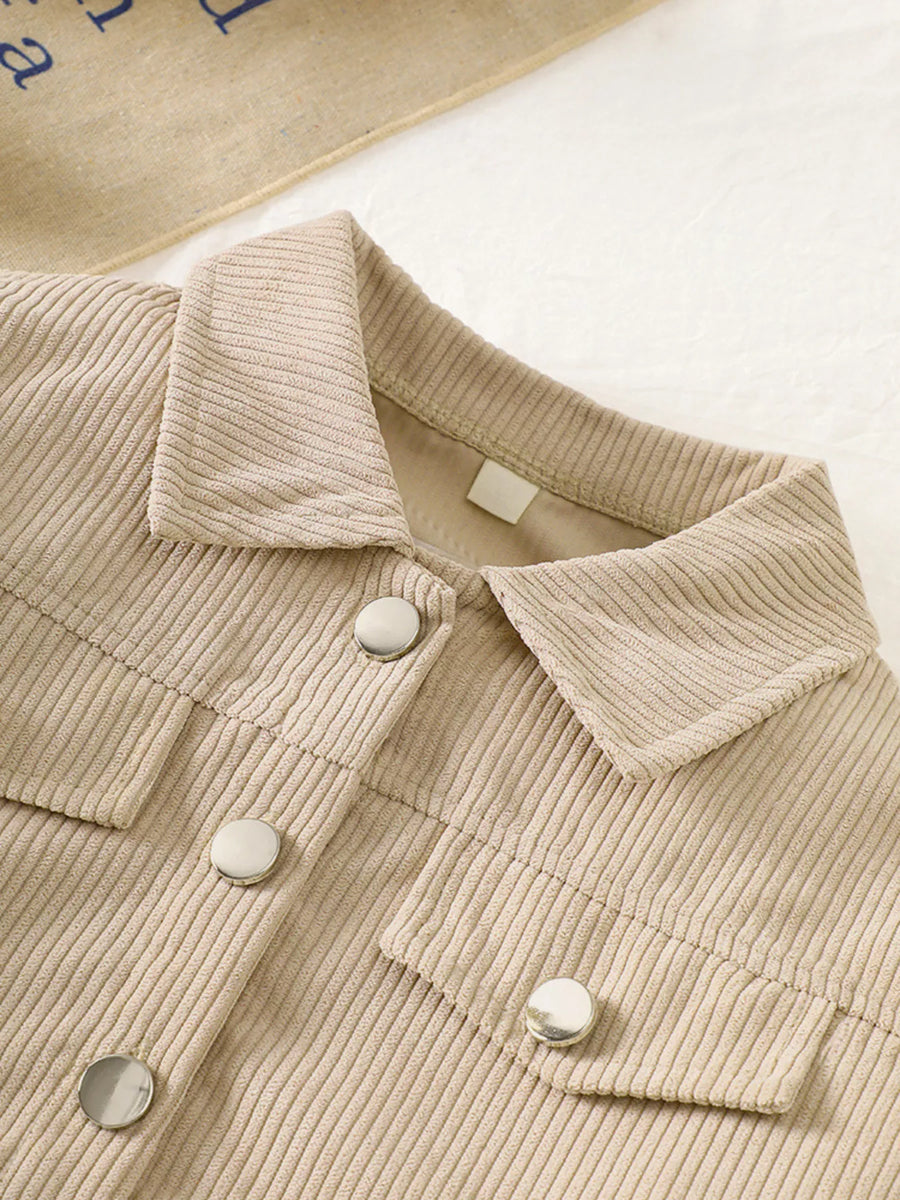 Casual tan corduroy button-up jacket with silver buttons and chest pockets.