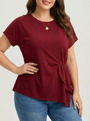 Plus-size burgundy crew neck t-shirt with asymmetrical ruched hem detail.