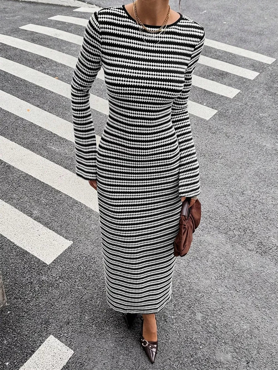 95% polyester, 5% elastane Care instructions: Machine wash cold sweater dress in Black with slim silhouette