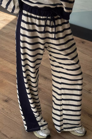 95% polyester, 5% elastane Care instructions: Machine wash cold lounge set in Stripe with relaxed silhouette