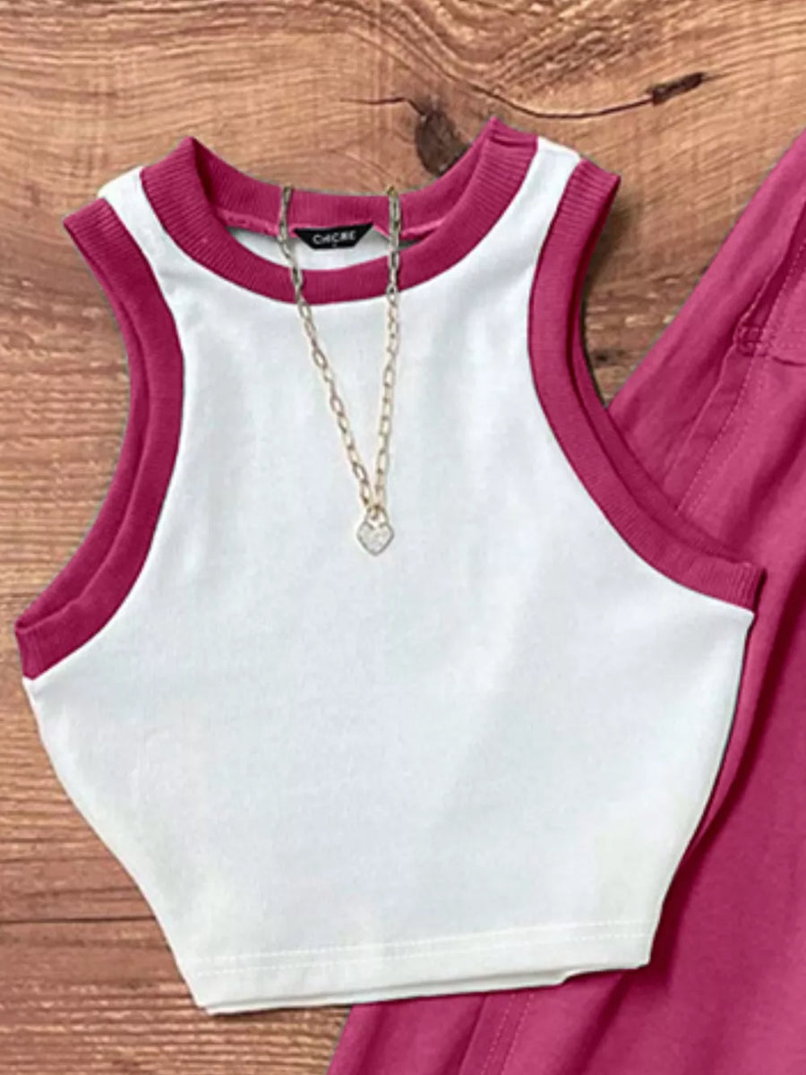 White polyester tank top with contrast trim and matching maxi skirt, styled with a necklace.