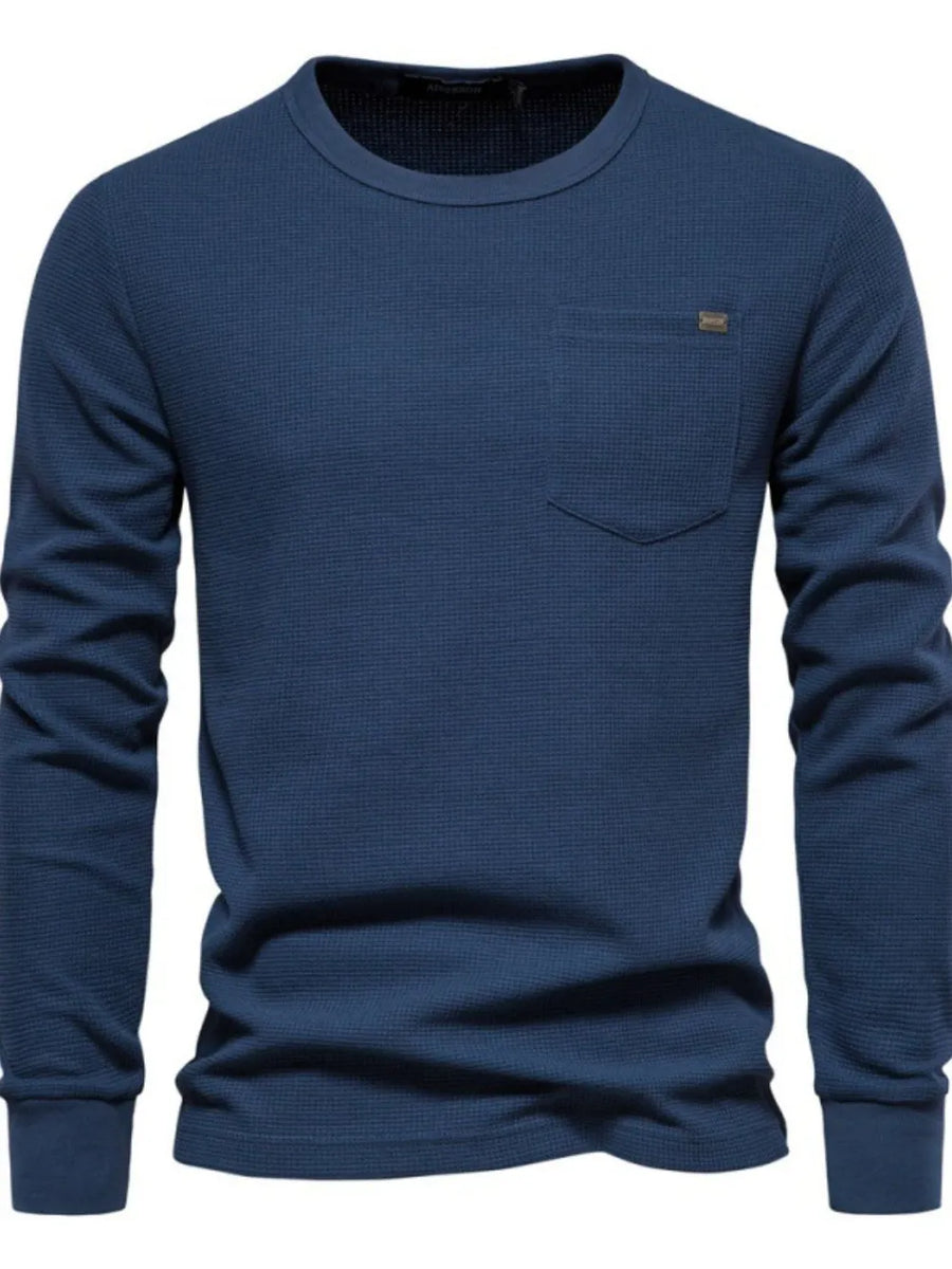Navy textured thermal long sleeve tee with chest pocket and minimalist detail.