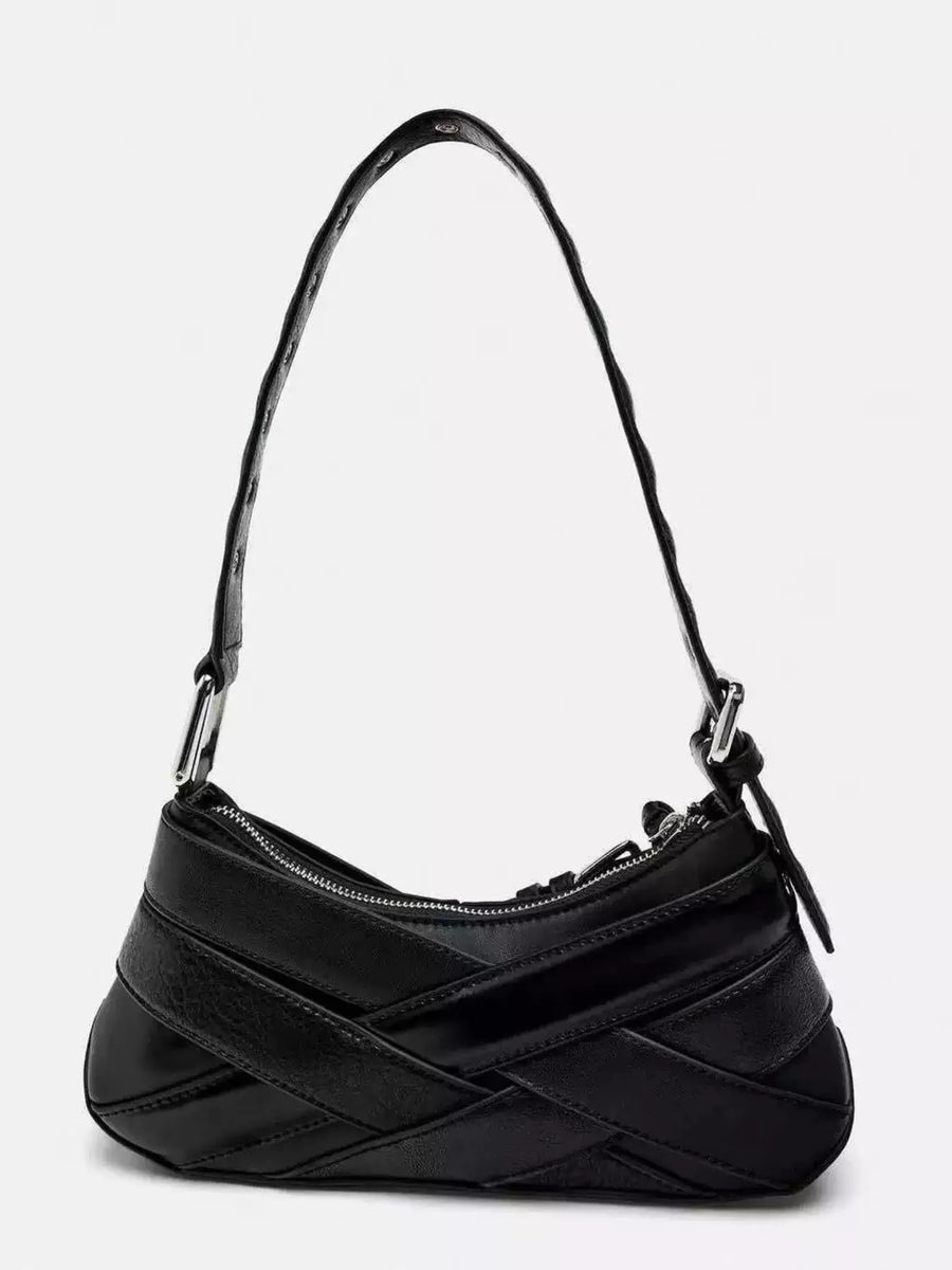 Black shoulder bag with woven strap detail and silver buckle accent