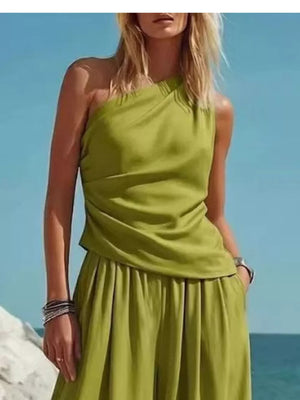 Green one-shoulder draped top and wide-leg pants set with a relaxed fit.