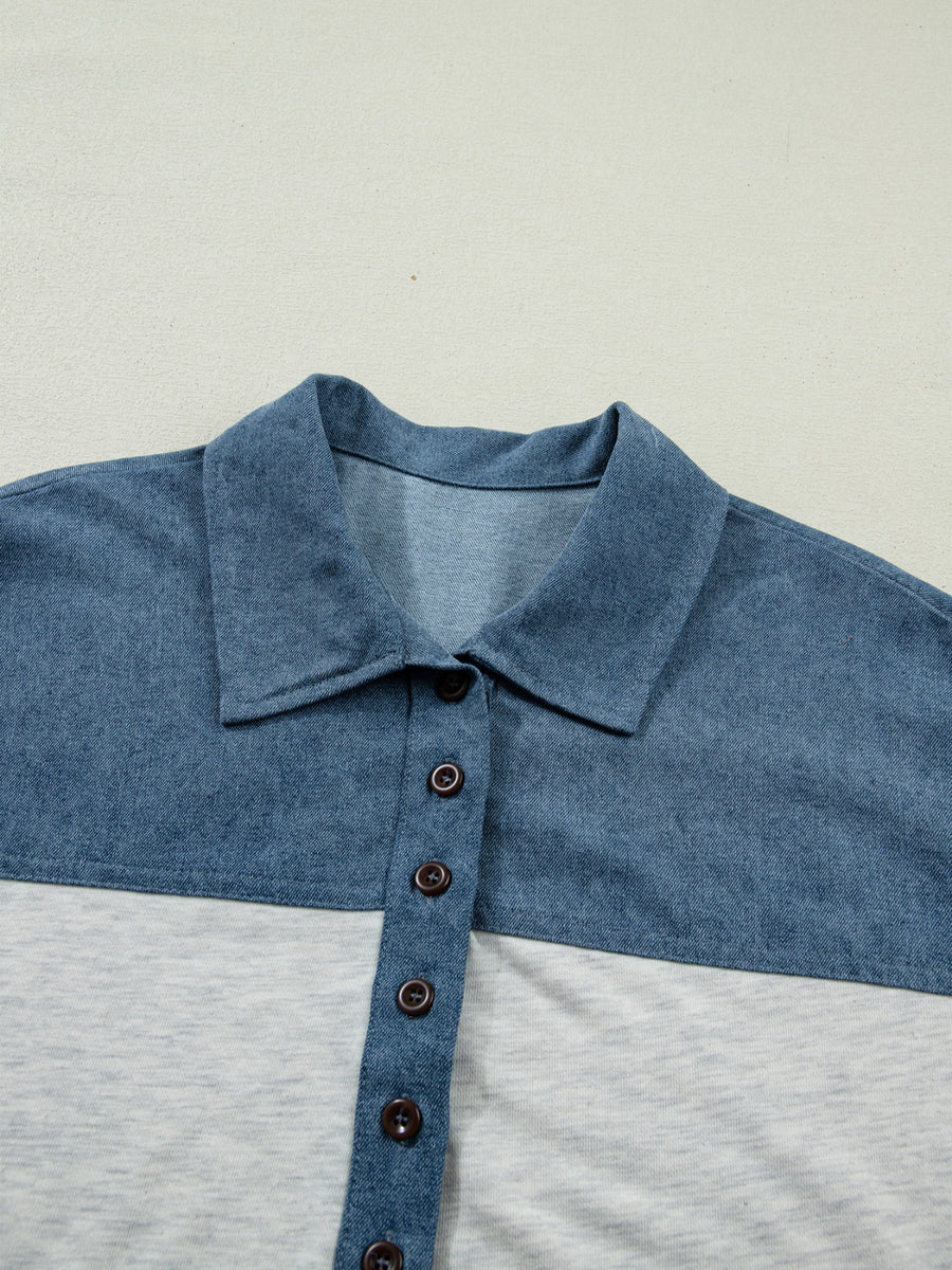Two-tone denim polo shirt with button-down front and classic collar.