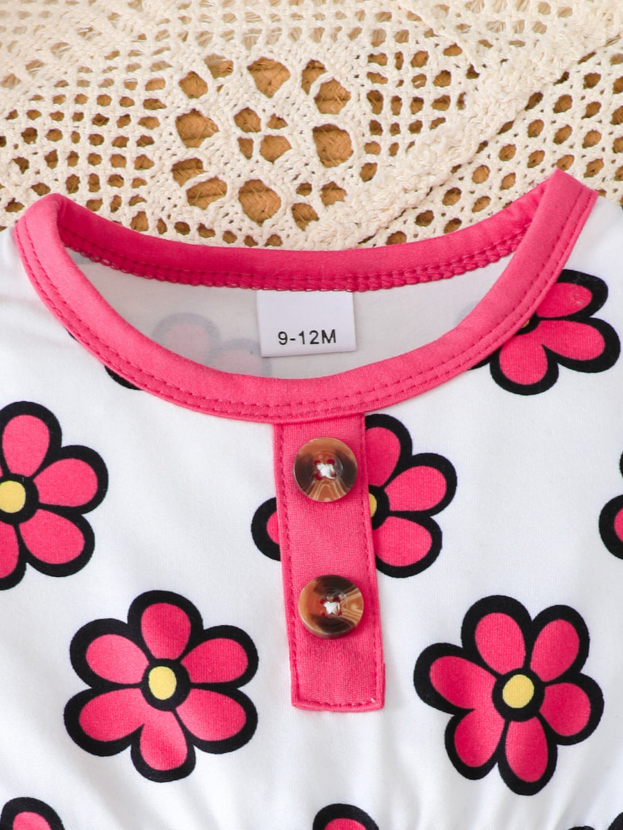 hot pink peplum top featuring decorative button and floral