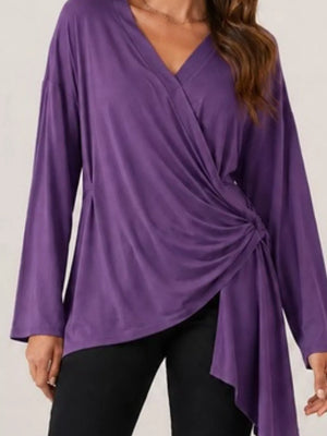 wrap top in dark purple featuring asymmetrical and relaxed fit