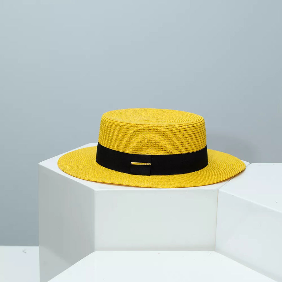 Yellow straw boater hat with black band and gold accent