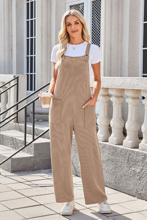 Caramel striped denim overalls with patch pockets and wide legs.