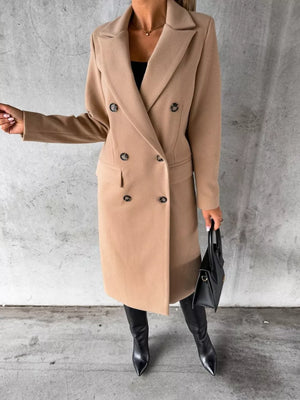 Chic double-breasted longline trench coat in apricot with button detail.