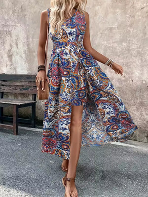 Maternity swim dress in multicolor paisley print with V-neck, cinched waist, and dramatic slit.